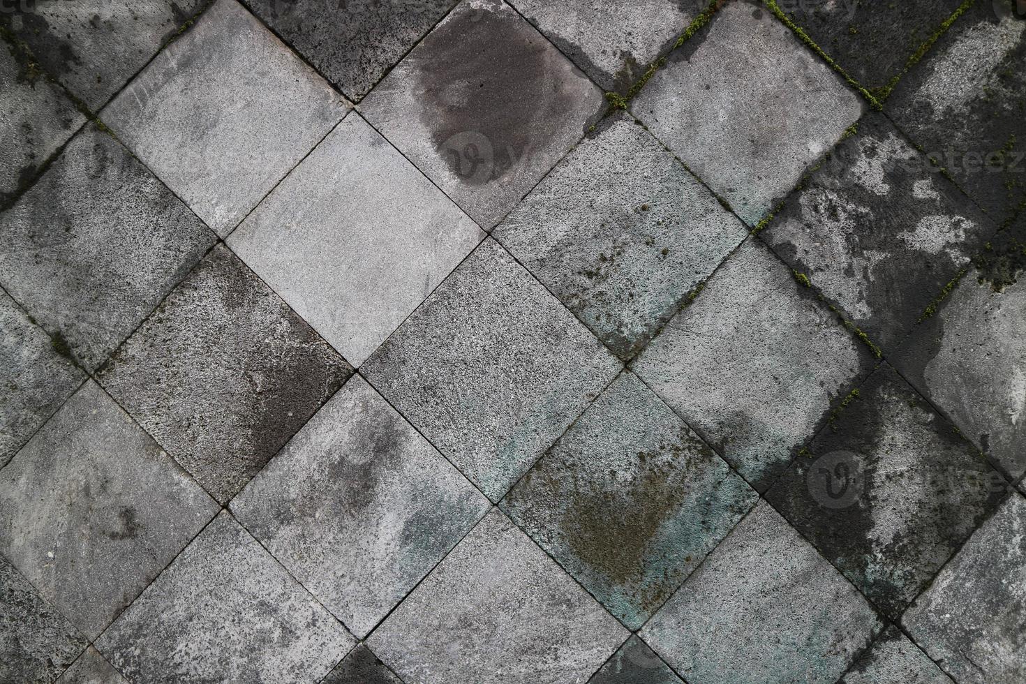 Abstract traditional stone wall pavement texture background. Bumpy textured stonewall made from flagstone and slabstone. photo