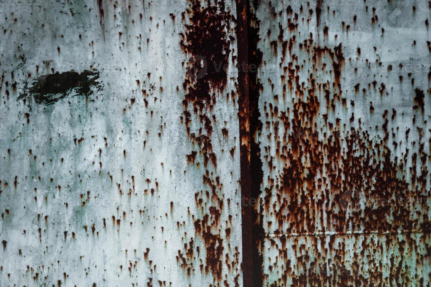 Old grunge rusty metal texture with scratches and crack. Vintage dark rustic metal background. photo