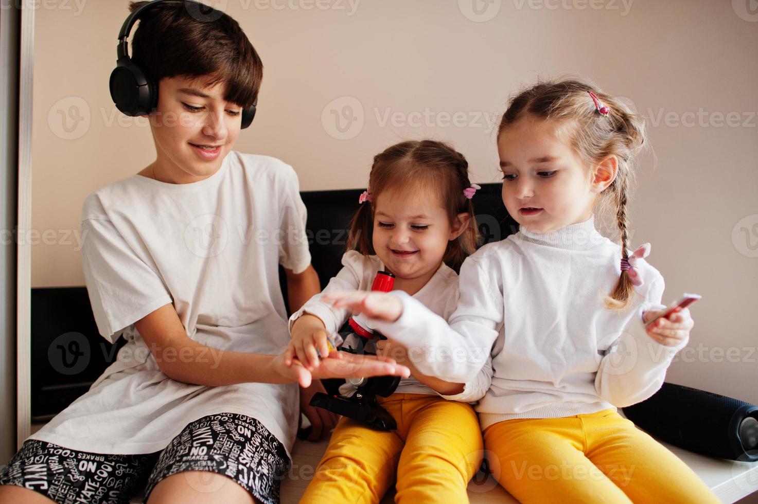 Kids using microscope learning science class at home. photo