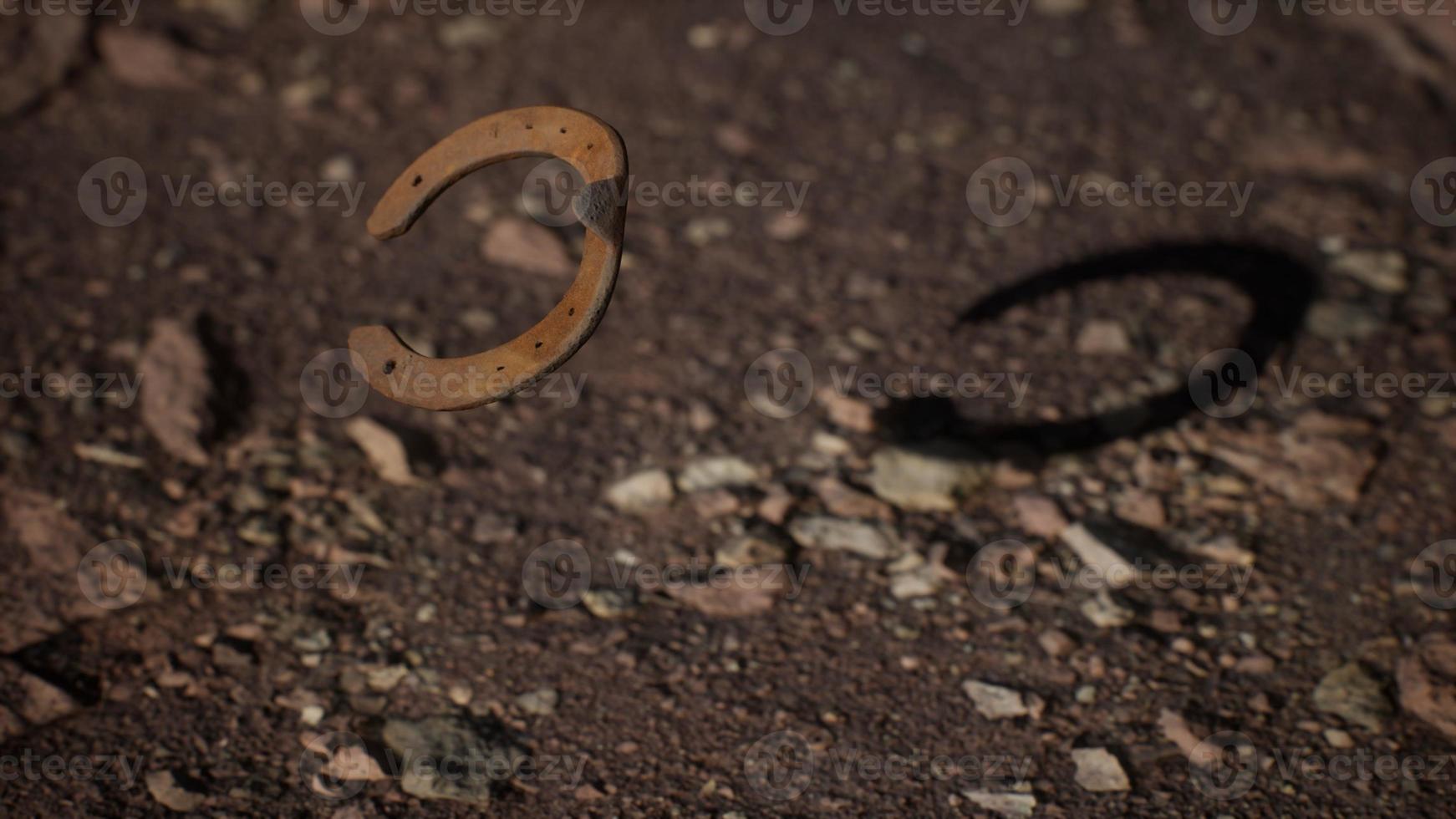 extreme slow motion old rusty metal horseshoe photo