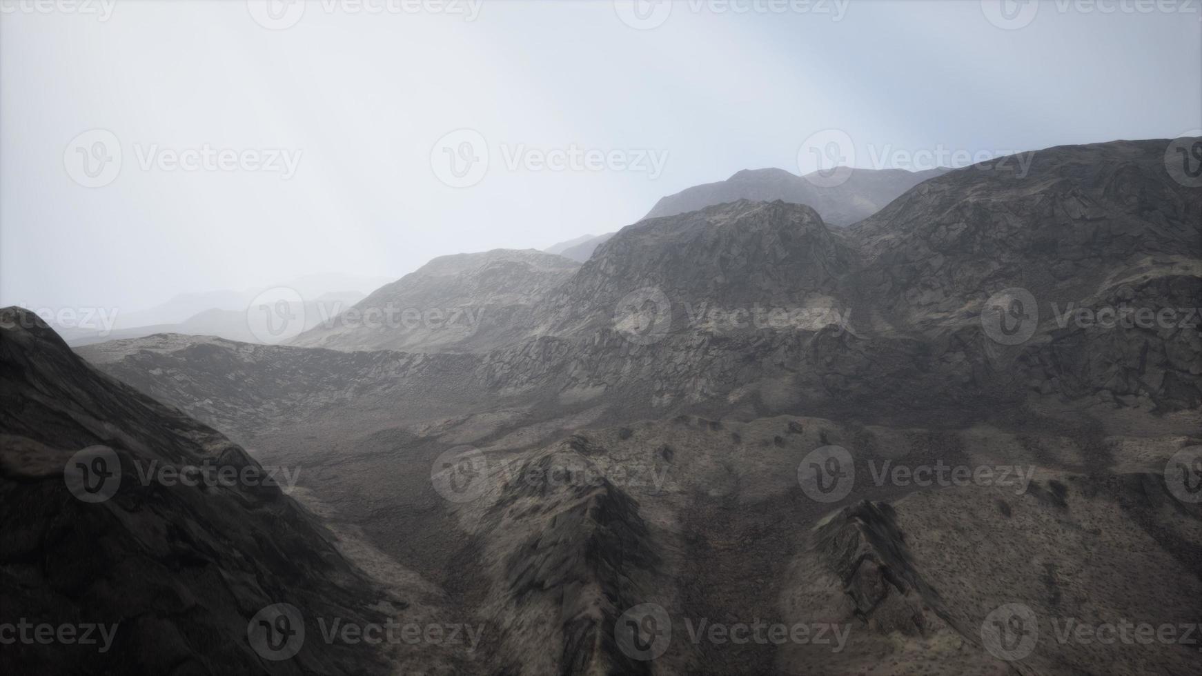 Sun Rays against the Backdrop of the Mountains photo