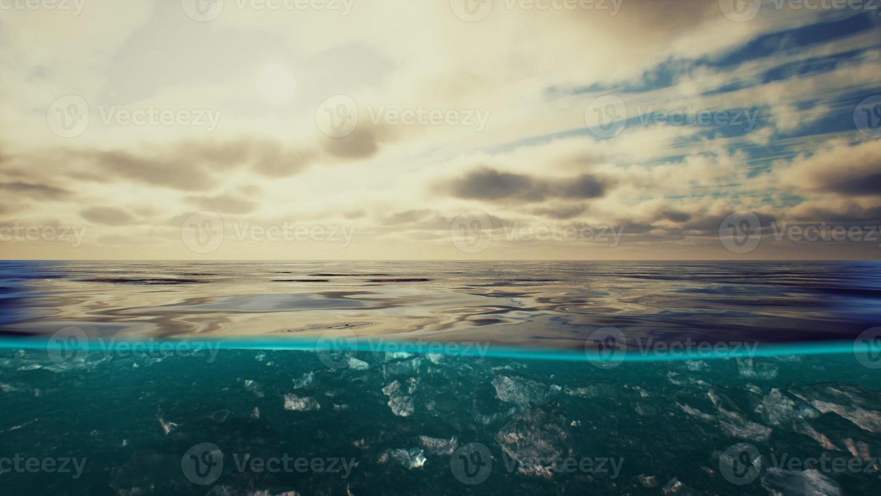 Split view over and under water in the Caribbean sea with clouds photo