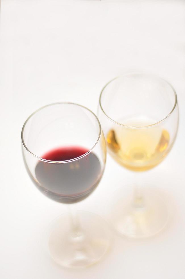 Two glasses of red and white wine  isolated on white photo