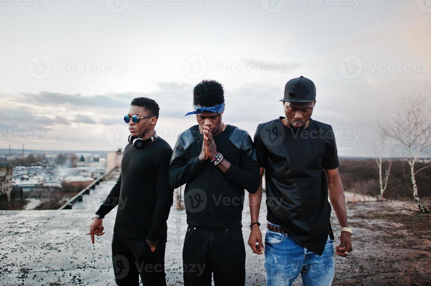 Three rap singers band on the roof photo