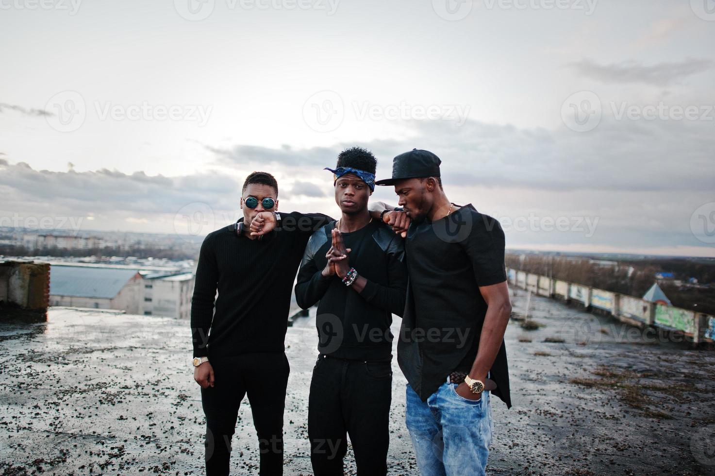 Three rap singers band on the roof photo