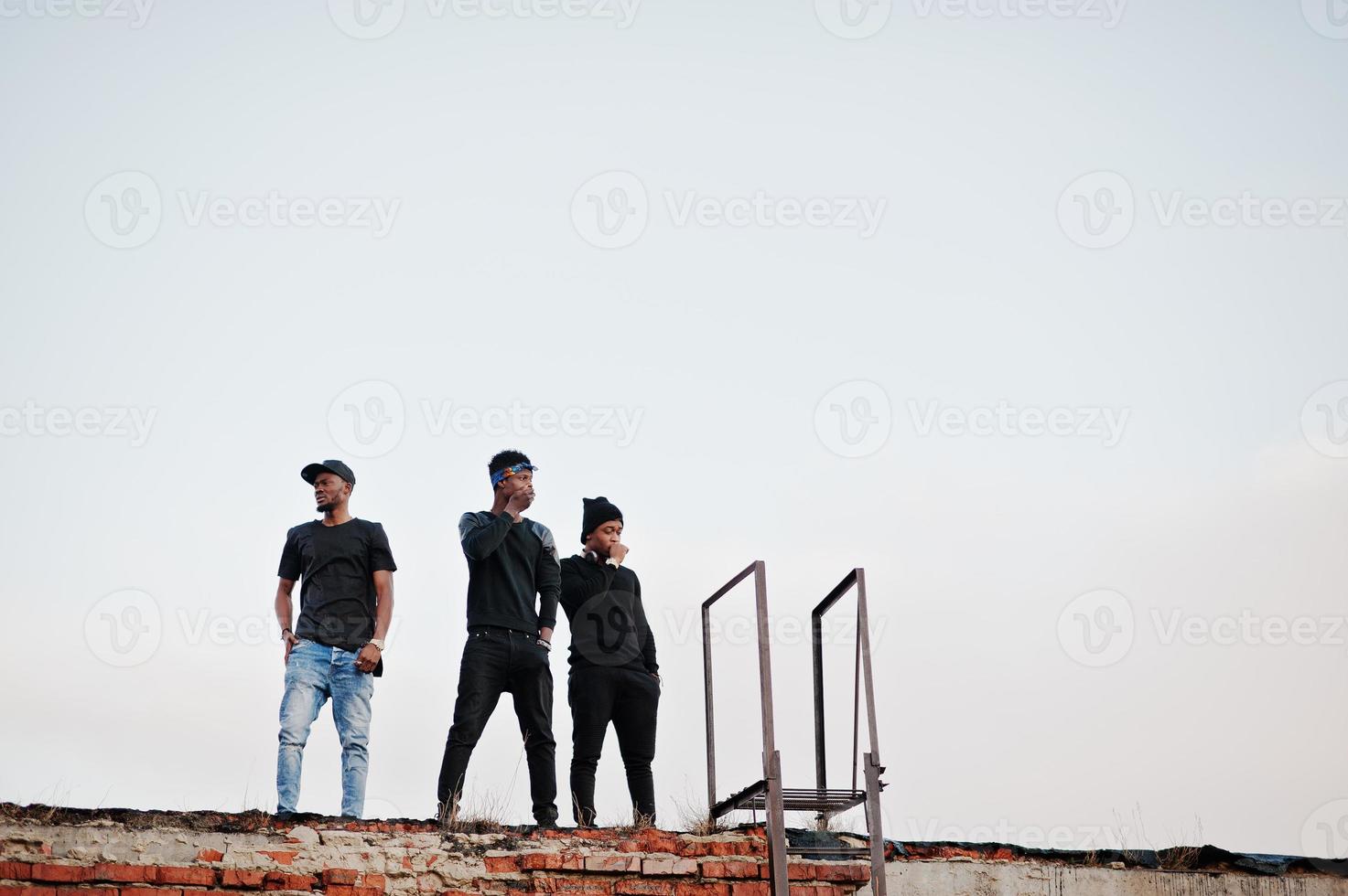 Three rap singers band on the roof photo