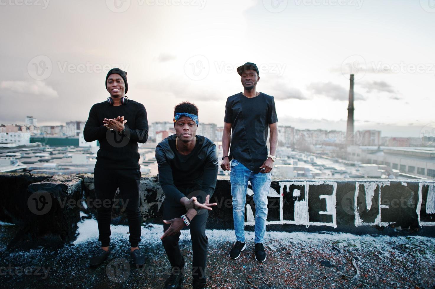 Three rap singers band on the roof photo