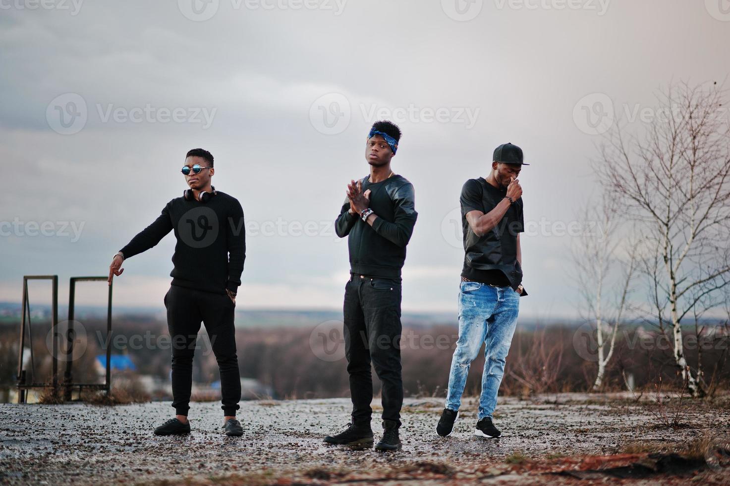 Three rap singers band on the roof photo