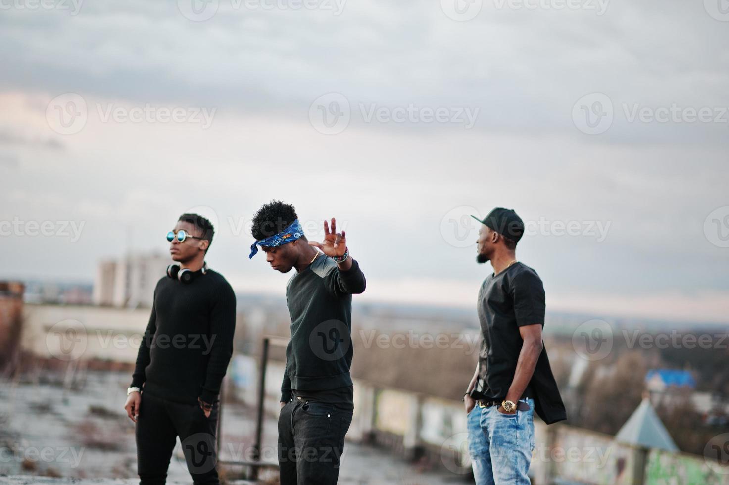 Three rap singers band on the roof photo