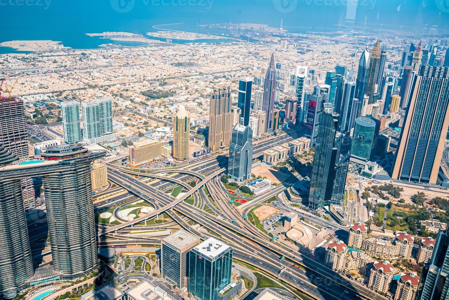 Dubai skyline with beautiful city near it's busiest highway. Amazing view of the junction roads from above. Traffic on the highway. photo