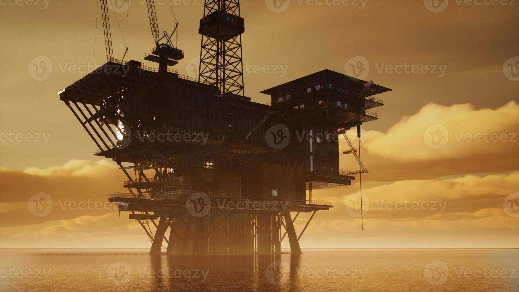 plataforma elevadora en alta mar en medio del mar al atardecer foto