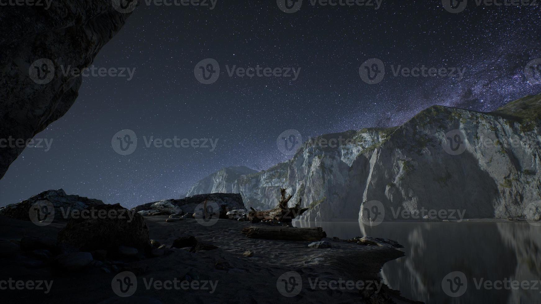 hyperlapse of night starry sky with mountain and ocean beach in Lofoten Norway photo