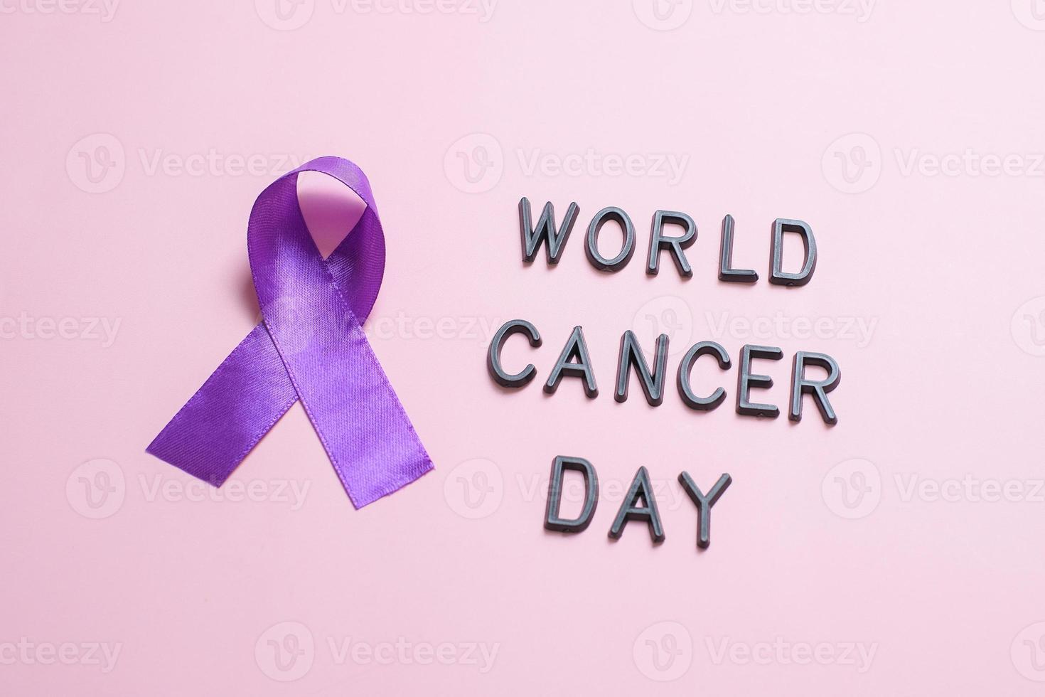 Purple ribbon as symbol of World Cancer Day concept photo