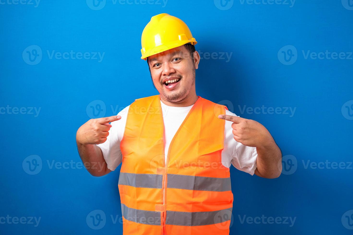 Asian worker man smile on face pointing oneself photo