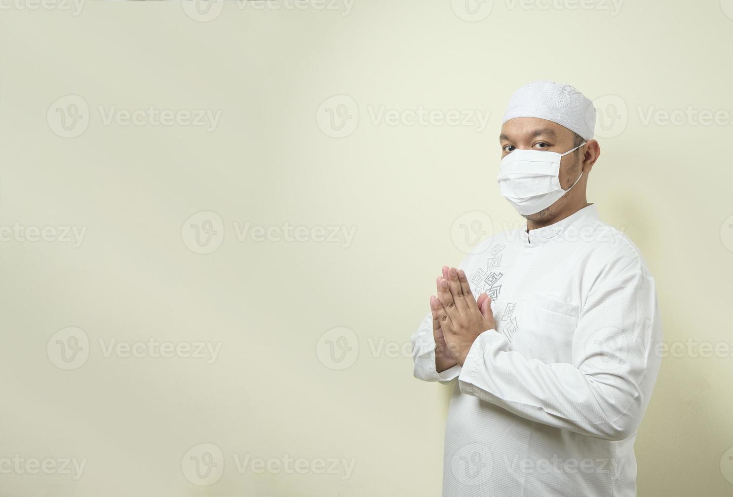 Asian Muslim men wearing mask with various gesture and expression photo