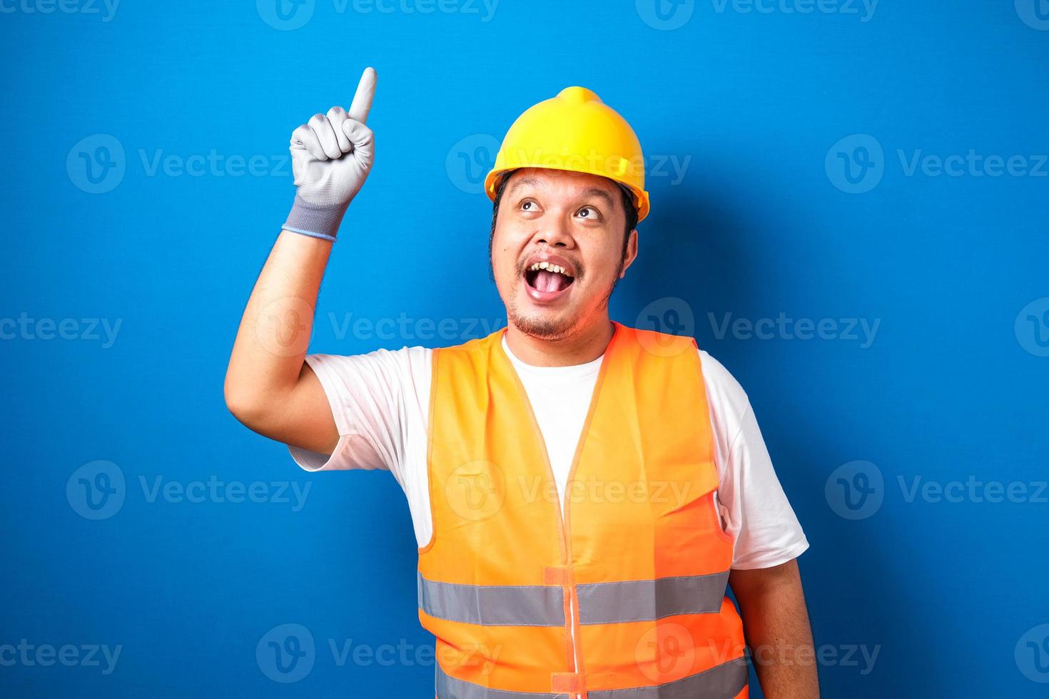 Asian workers wearing helmets are seen looking for ideas photo