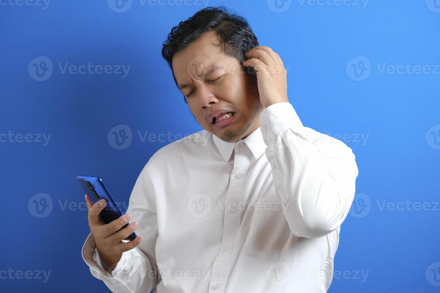 Sad Asian Man Has Bad Online Chat News And Feels Disappointed On The  Smartphone. Stock Photo, Picture and Royalty Free Image. Image 175416709.