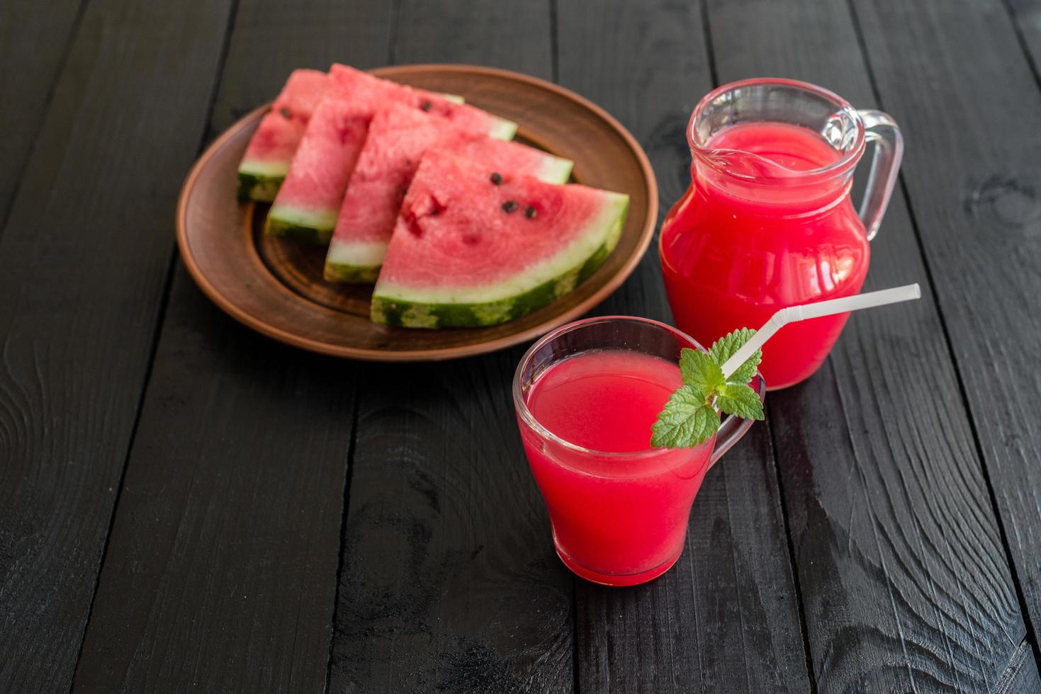 Watermelon smoothies topping with fresh mint leaves photo