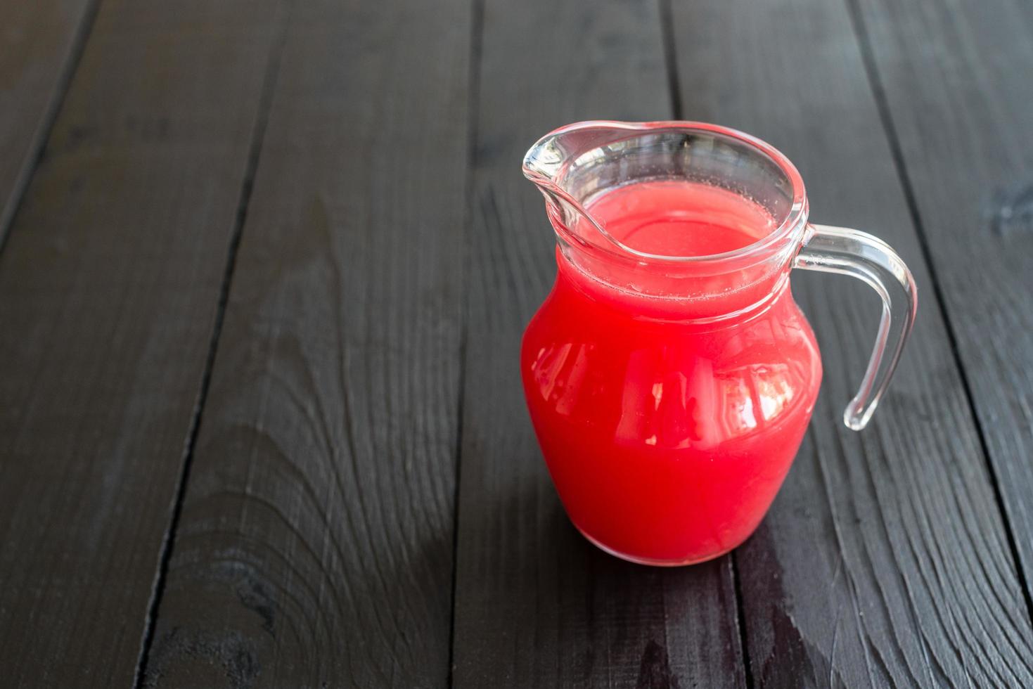 Watermelon smoothies topping with fresh mint leaves photo