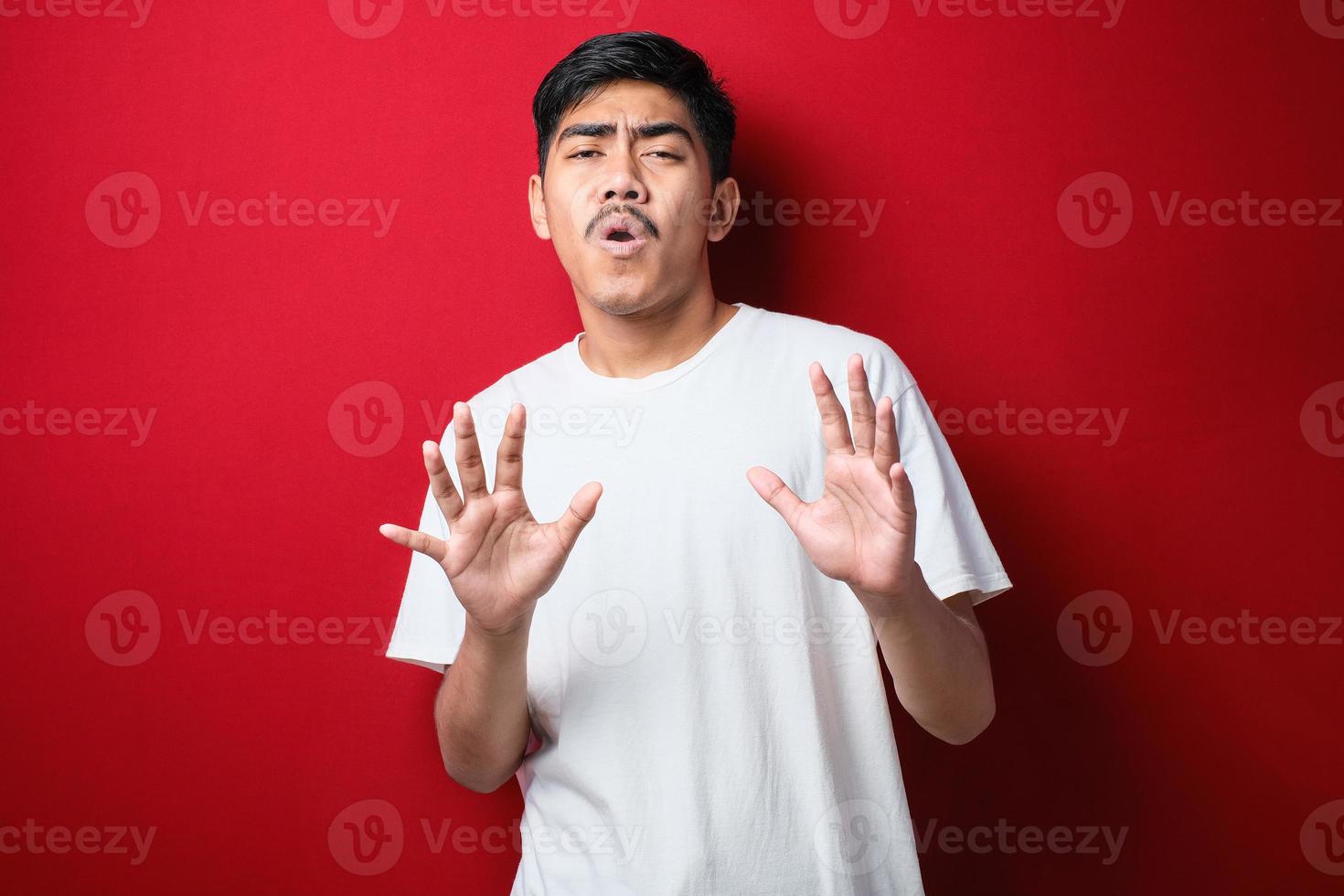 Young handsome asian man wearing casual shirt moving away hands palms showing refusal and denial with afraid and disgusting expression. Stop and forbidden. photo