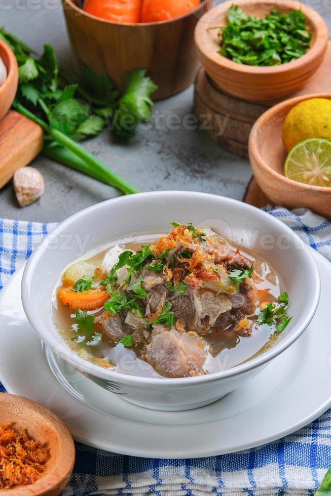 Indonesian traditional culinary, called sop buntut or oxtail soup photo