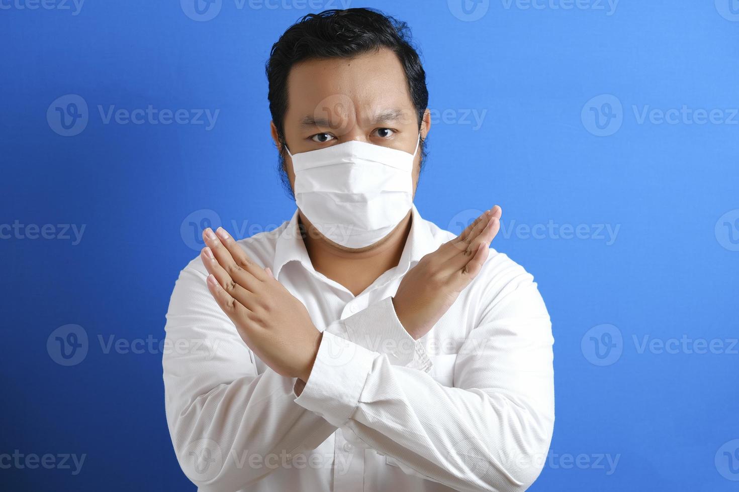 a fat Asian man wearing a mask to prevent transmission of the corona virus photo