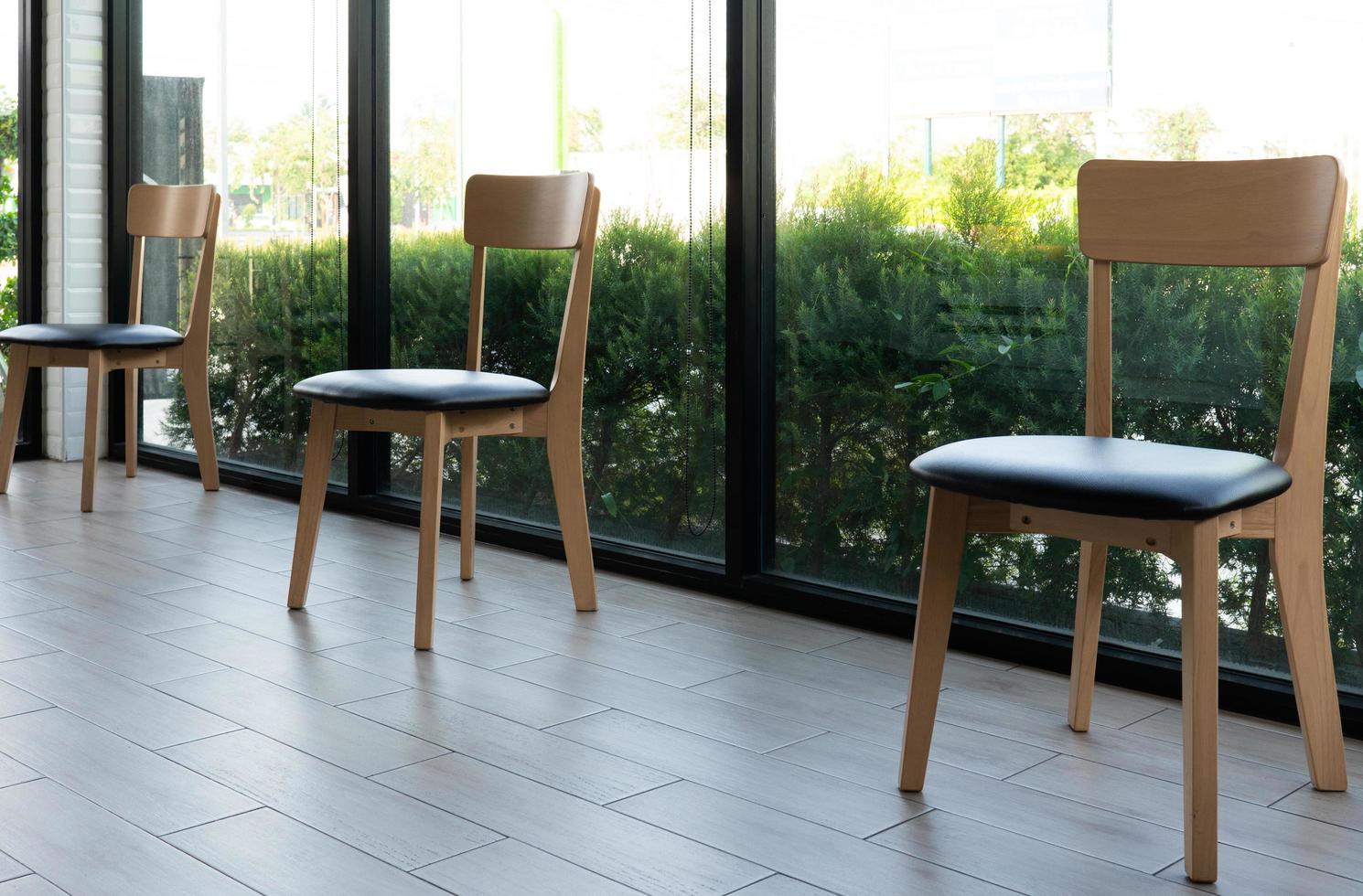 Picture of chairs in the restaurant that was placed spreadly due to social distancing or isolation during covid-19 or coronavirus pandemic to prevent infection. new normal lifestyle concept photo