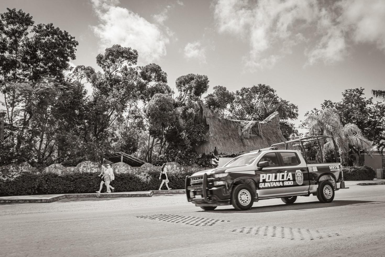 Tulum Mexico 02. February 2022 Police car pickup truck drives fast street road Tulum Mexico. photo