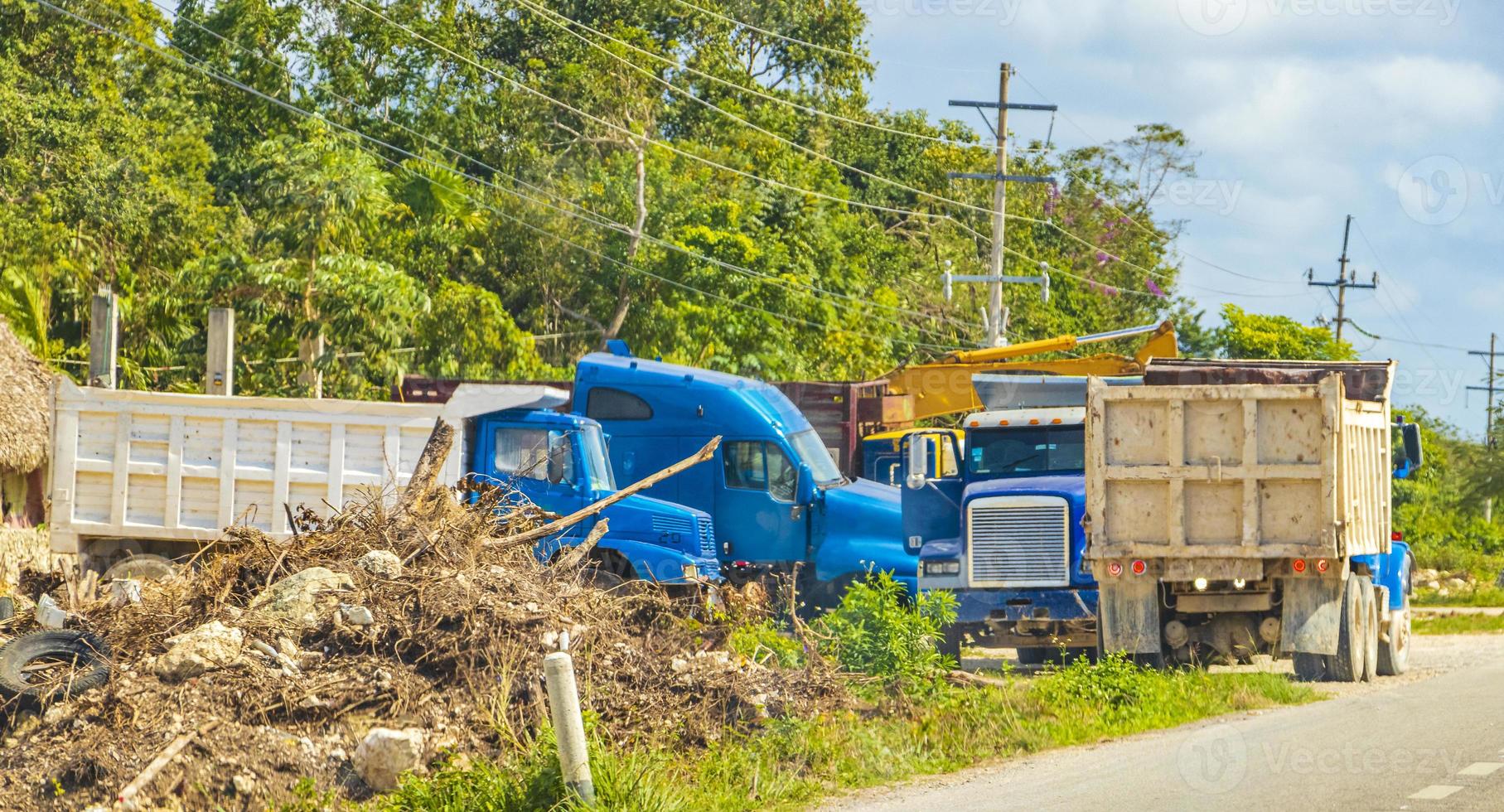 Trucks dump truck excavators and other industrial vehicles Tulum Mexico. photo