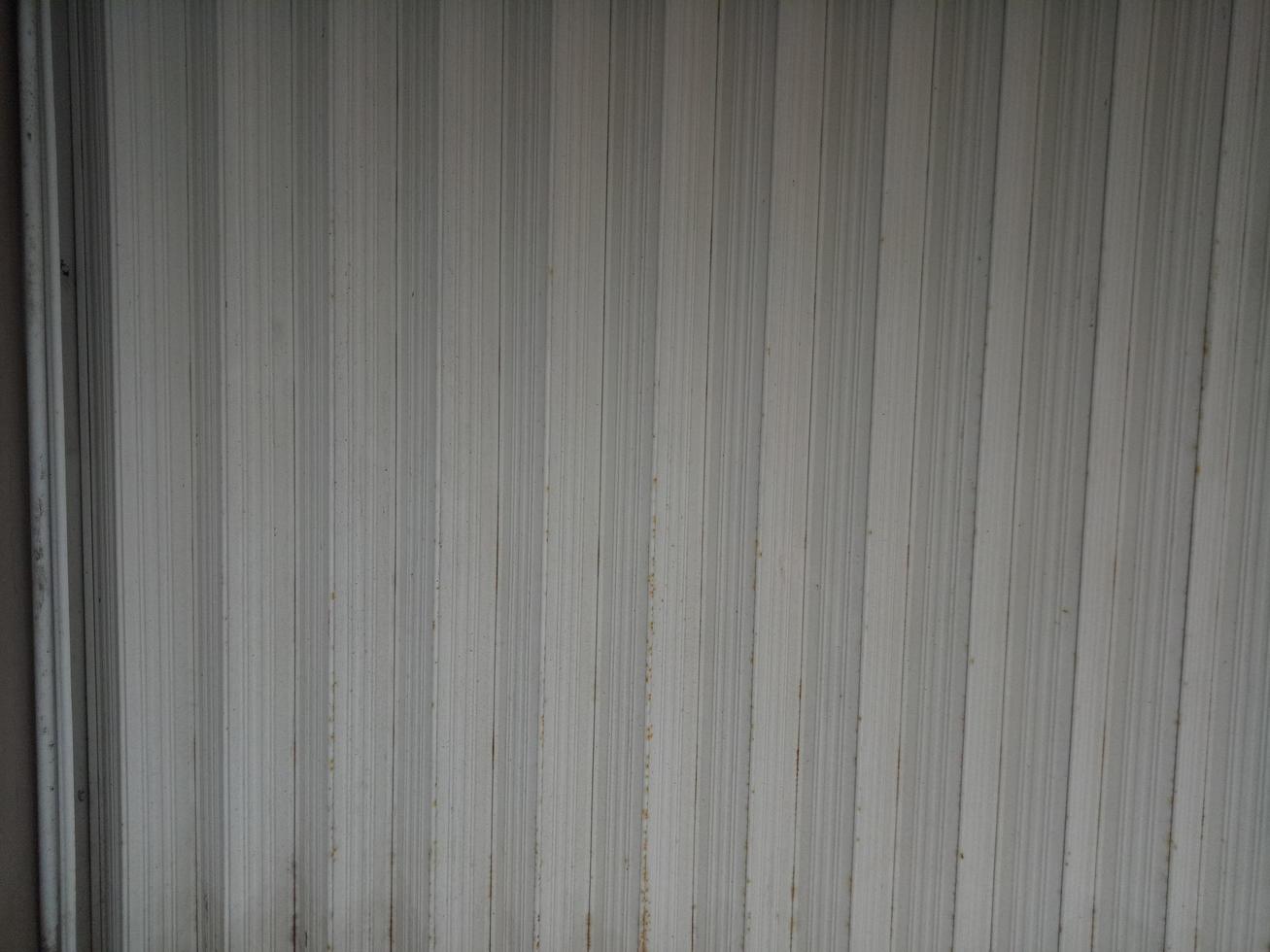 Dull and rusty white folding door photo