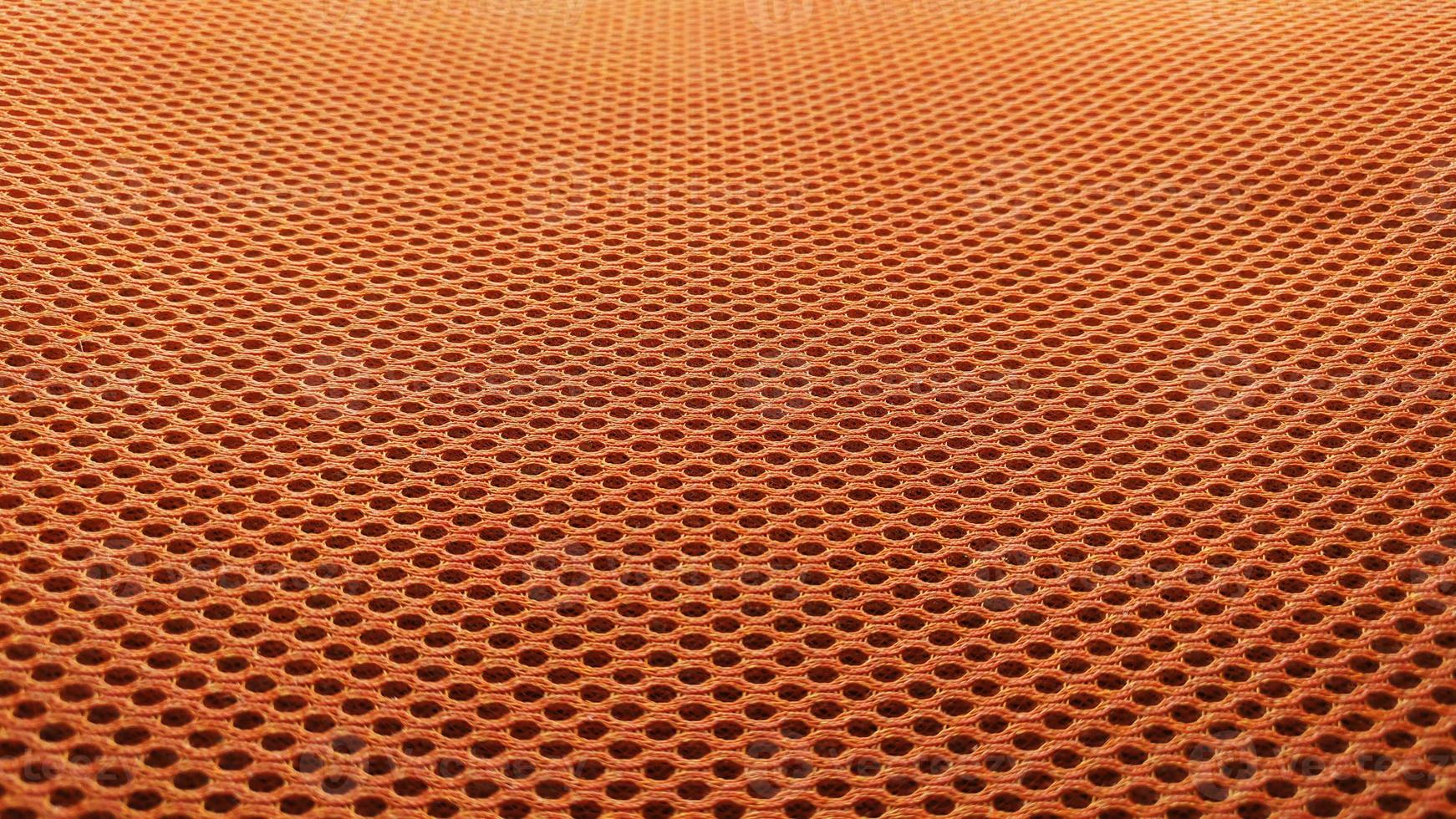 Orange nylon fabric pattern texture background. photo