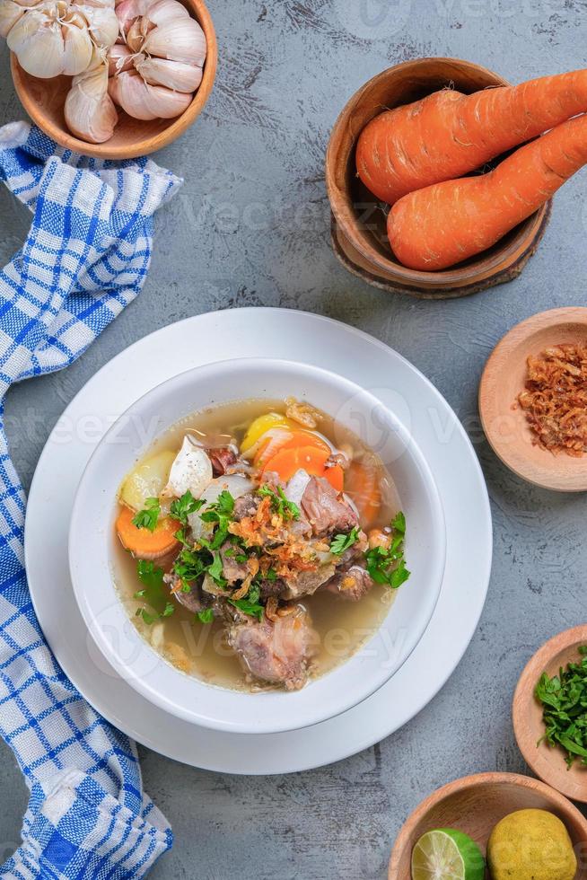 Indonesian traditional culinary, called sop buntut or oxtail soup photo
