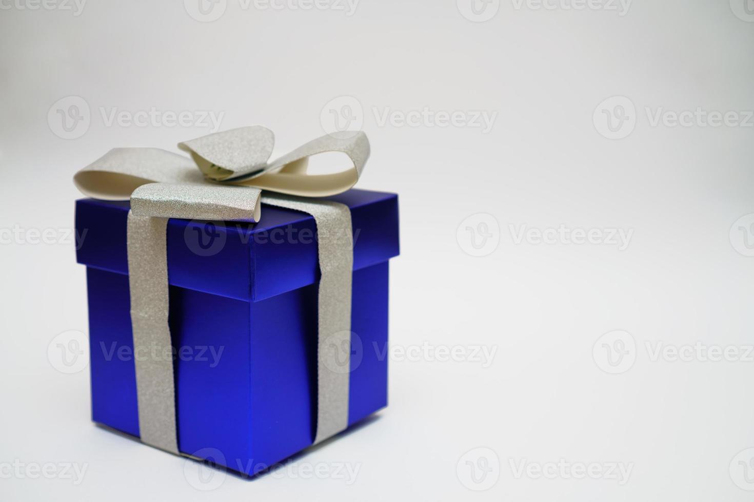 Blue gift box on white background photo