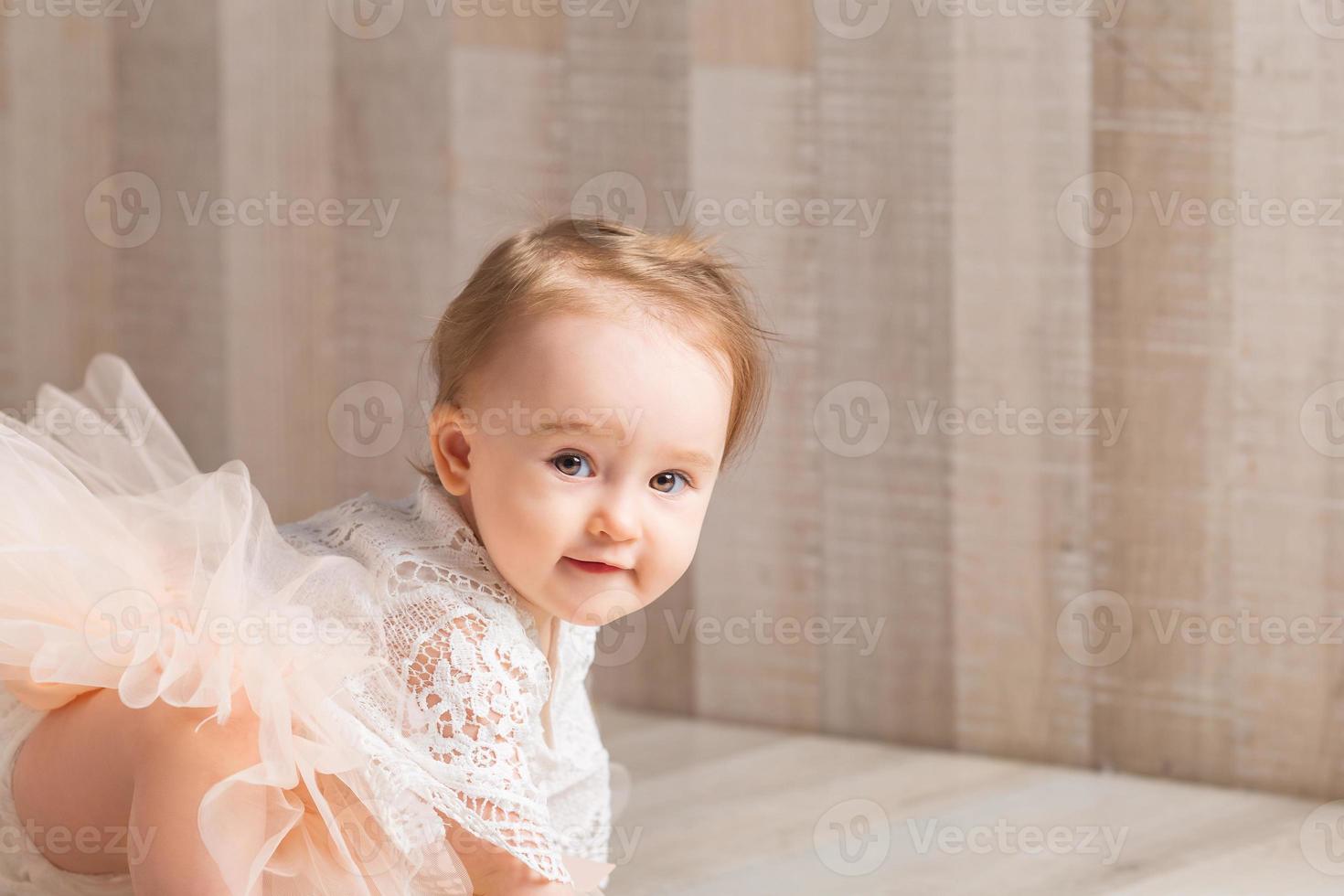 portrait of a cute little one-year-old girl photo