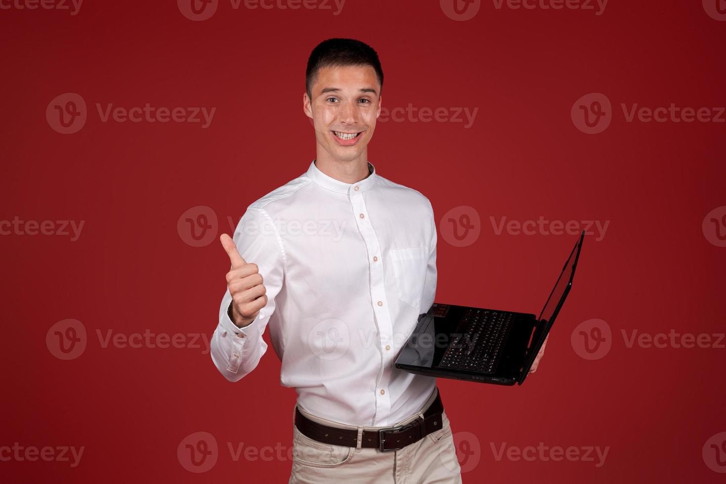 Young smiling successful businessman caucasian male in white shirt index finger photo