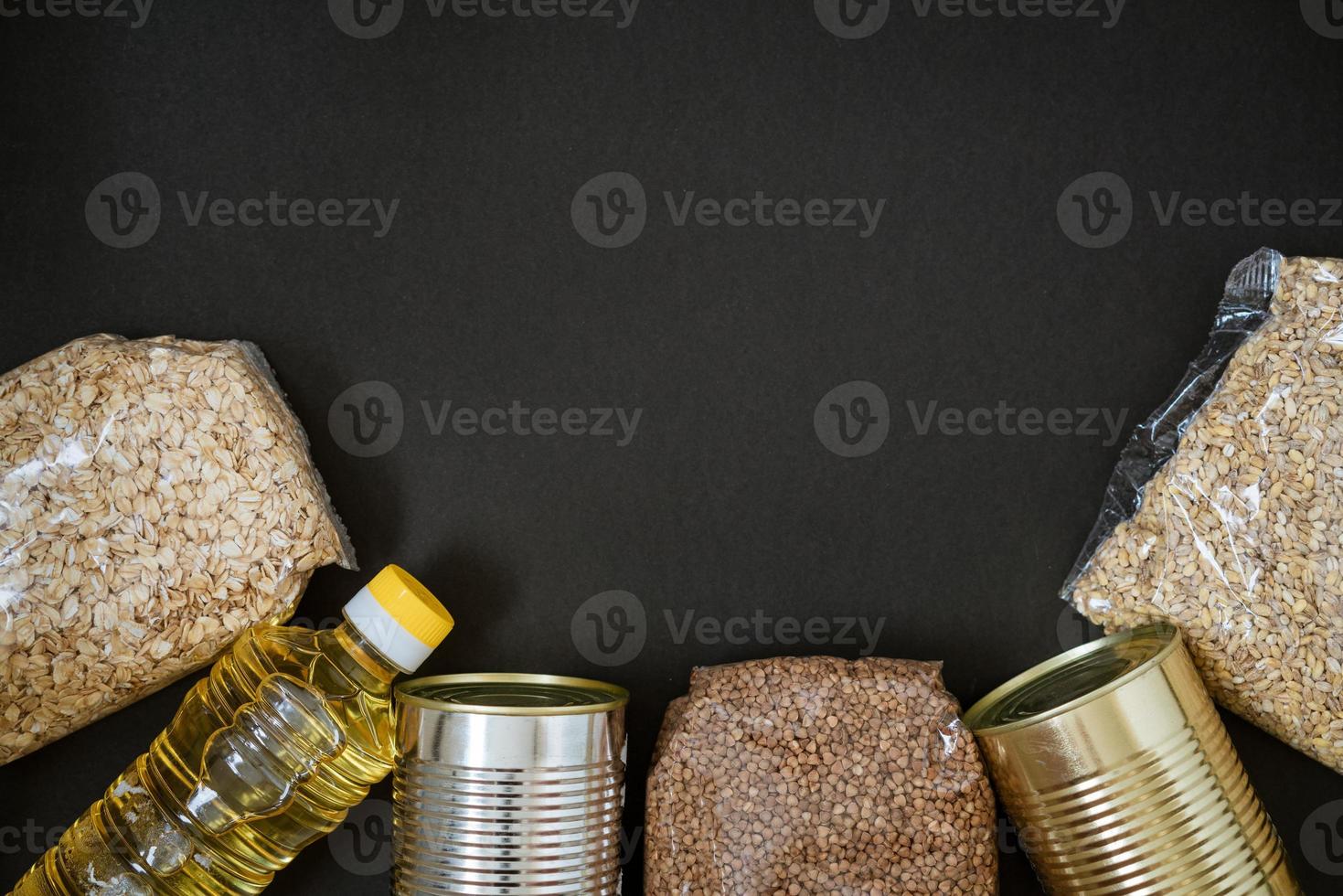 Grains on a black background, the concept of donation photo