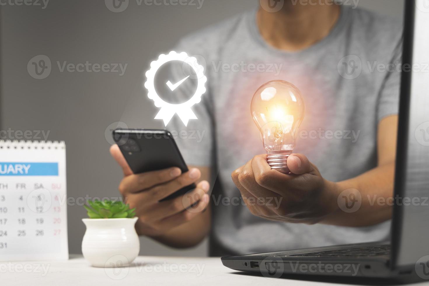 Hand of man holding illuminated light bulb, idea, innovation and inspiration concept. photo