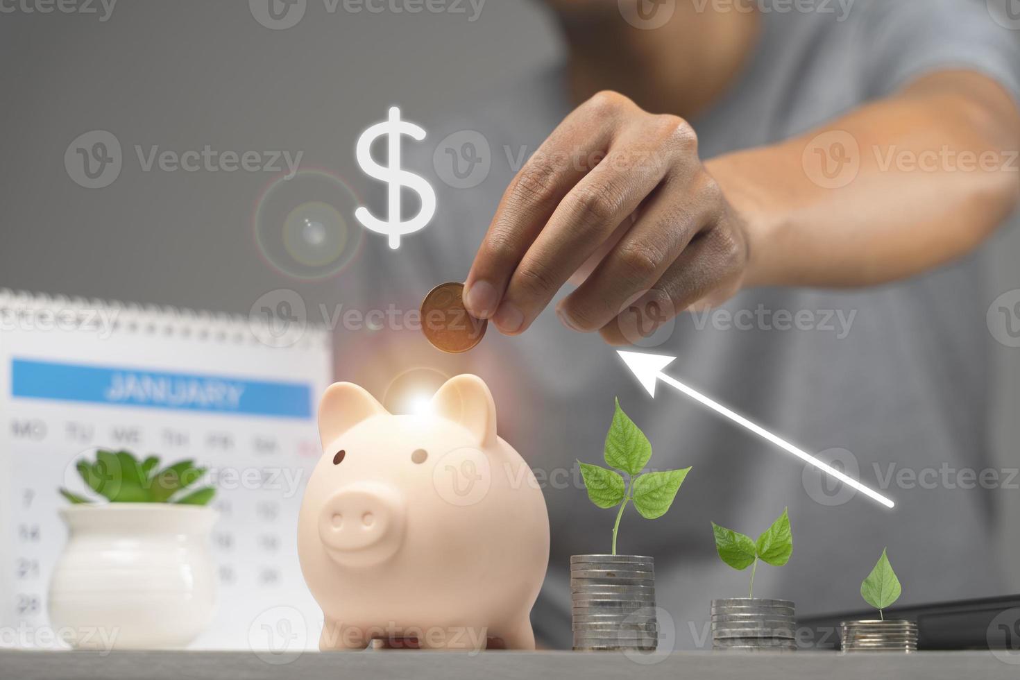 Man putting coin in piggy bank with growing coin. Saving money concept photo