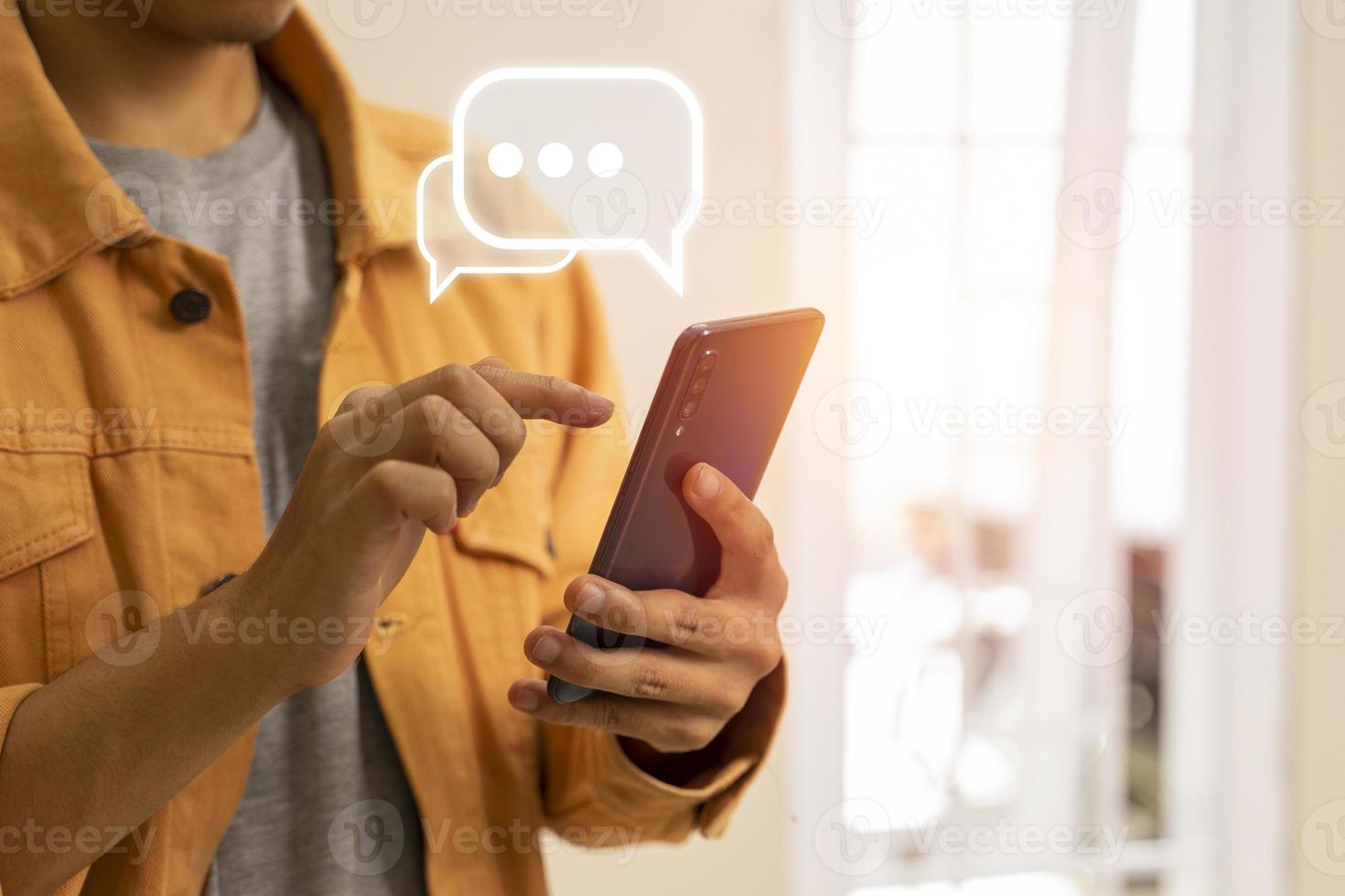 Man hand typing on mobile smartphone, Live Chat chatting on mobile app, social network photo