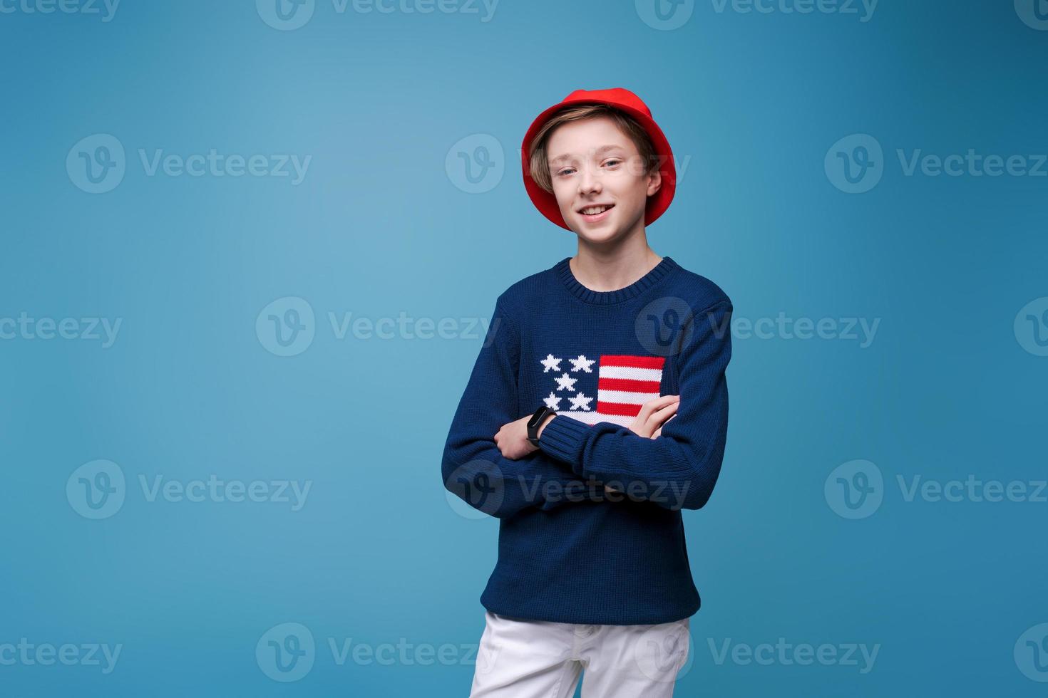 Portrait of young handsome hipster man in blue sweater with usa flag and photo