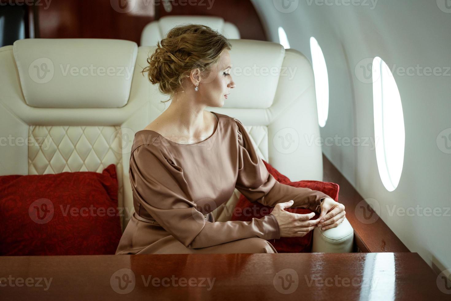 attractive woman on a private jet photo