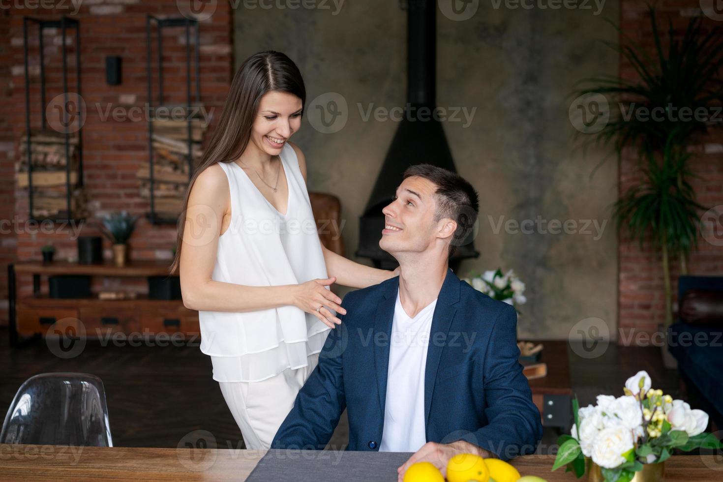 Laughing excited married couple rejoice in their happiness by winning prize photo