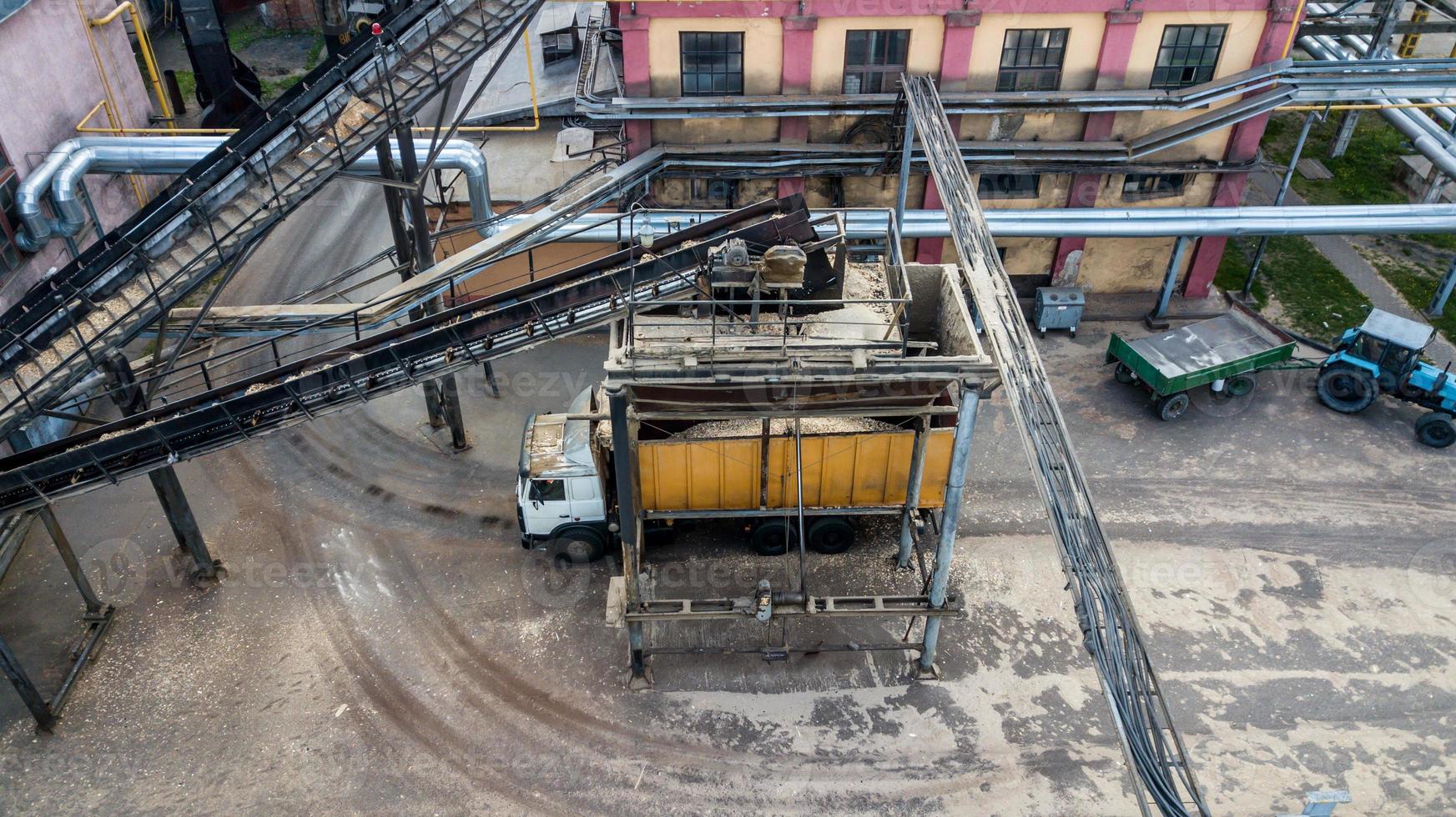 loading a truck Transporter at an industrial enterprise top view from a drone photo