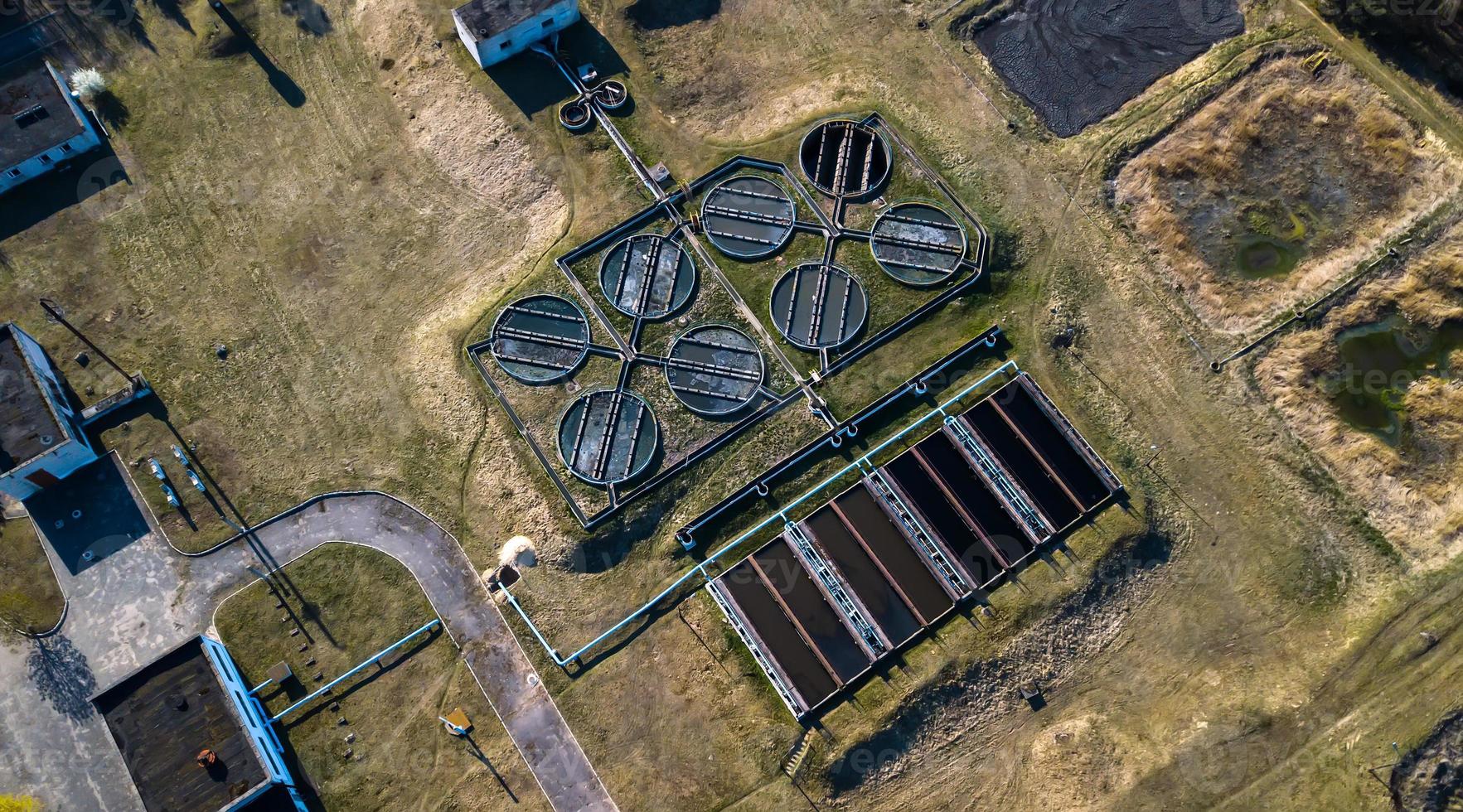 Aerial view of sewage treatment plant. Industrial water treatment for big city from drone view photo