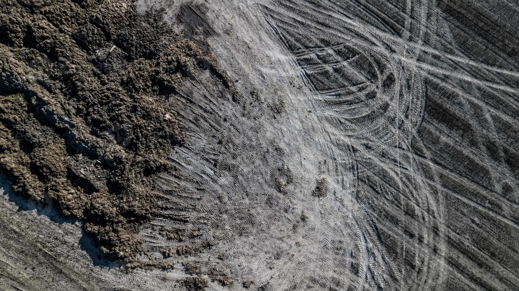 Manure pile on the field. Spring field work. Aerial survey photo