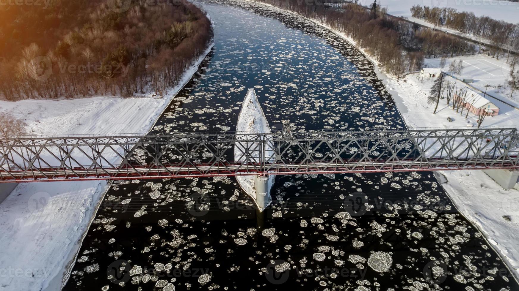 Ice floes floating on the river photo