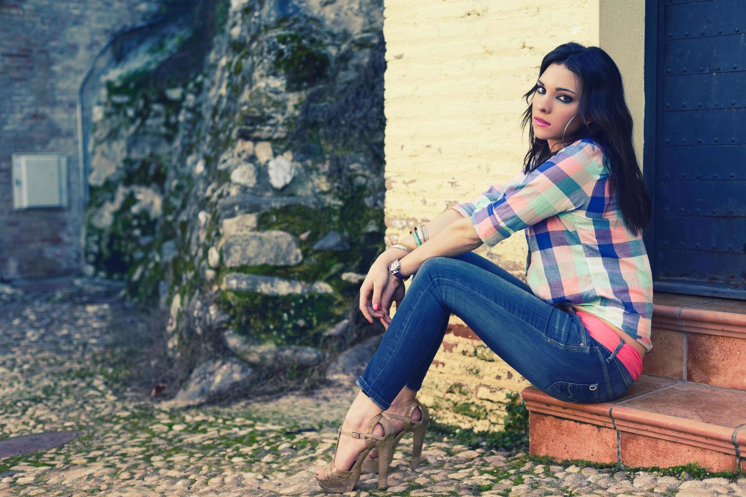 Young beautiful woman in a urban background photo