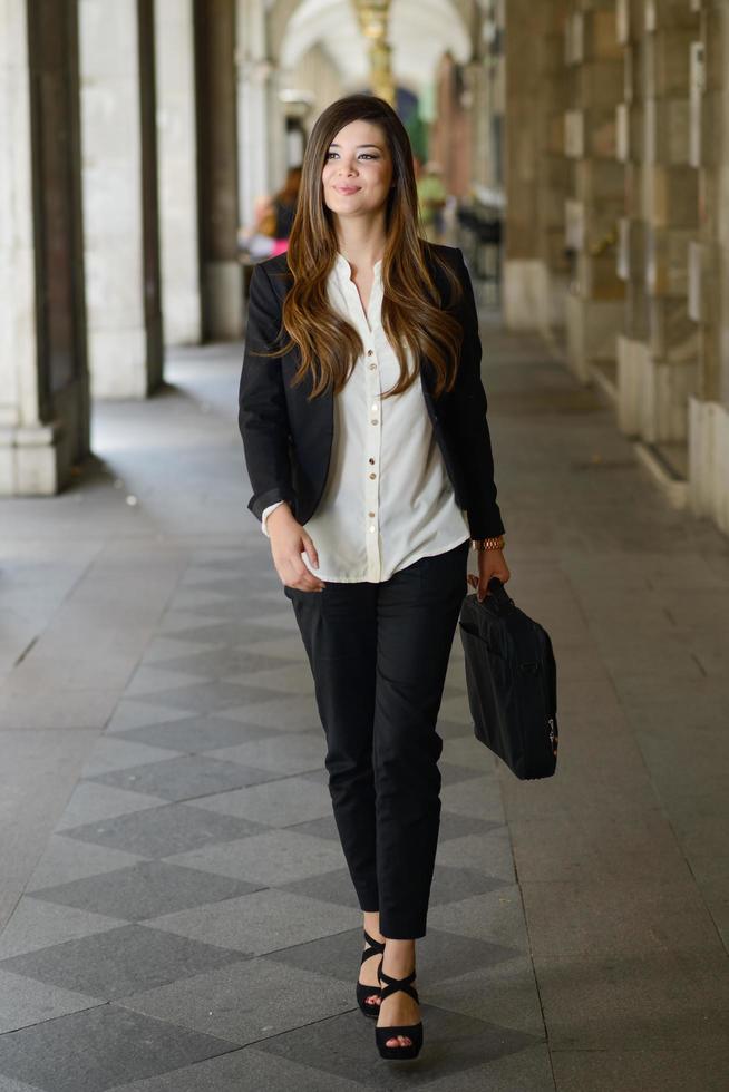 Japanese business woman in urban background photo