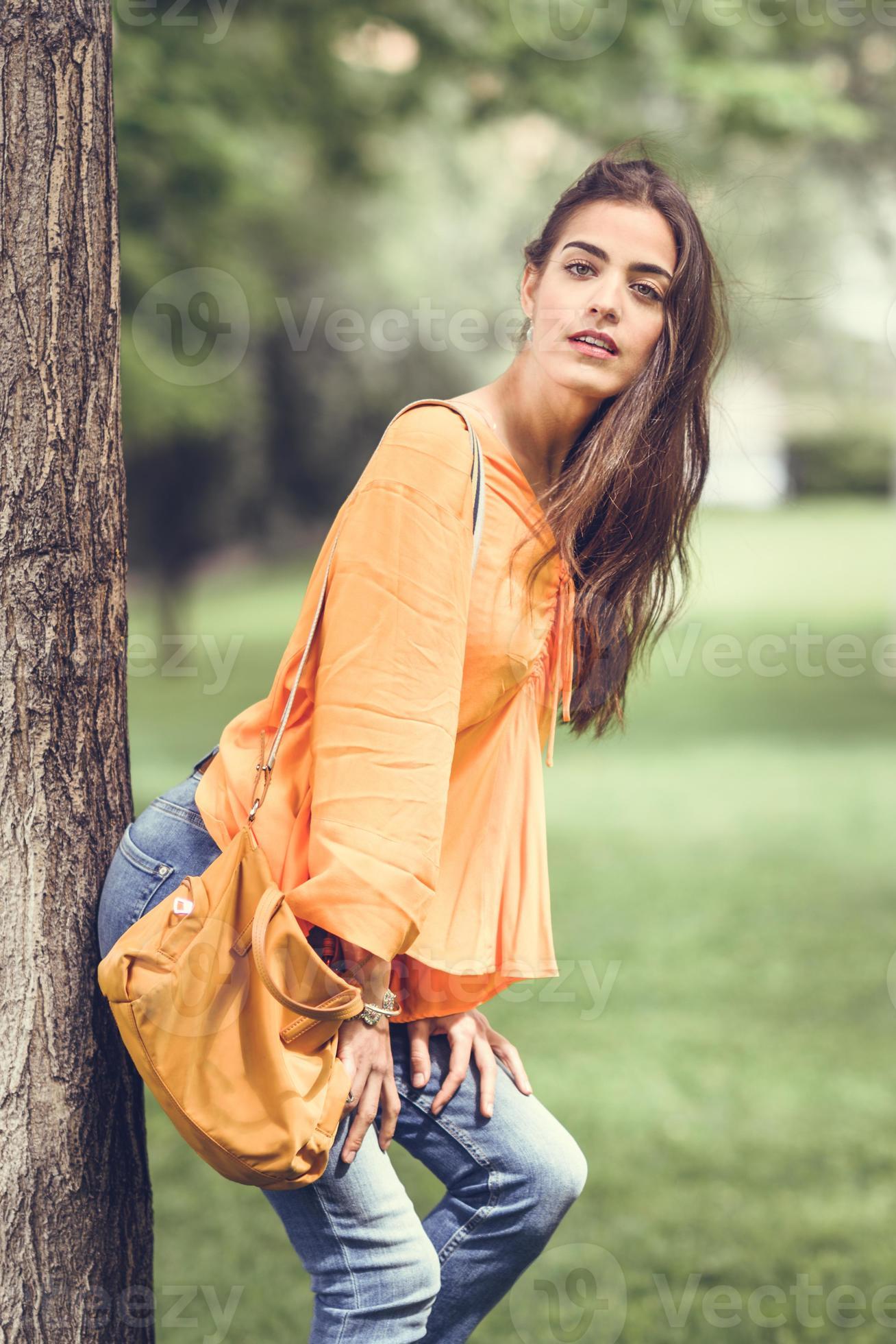 Woman with nice hair wearing casual clothes in urban background. 5885704  Stock Photo at Vecteezy
