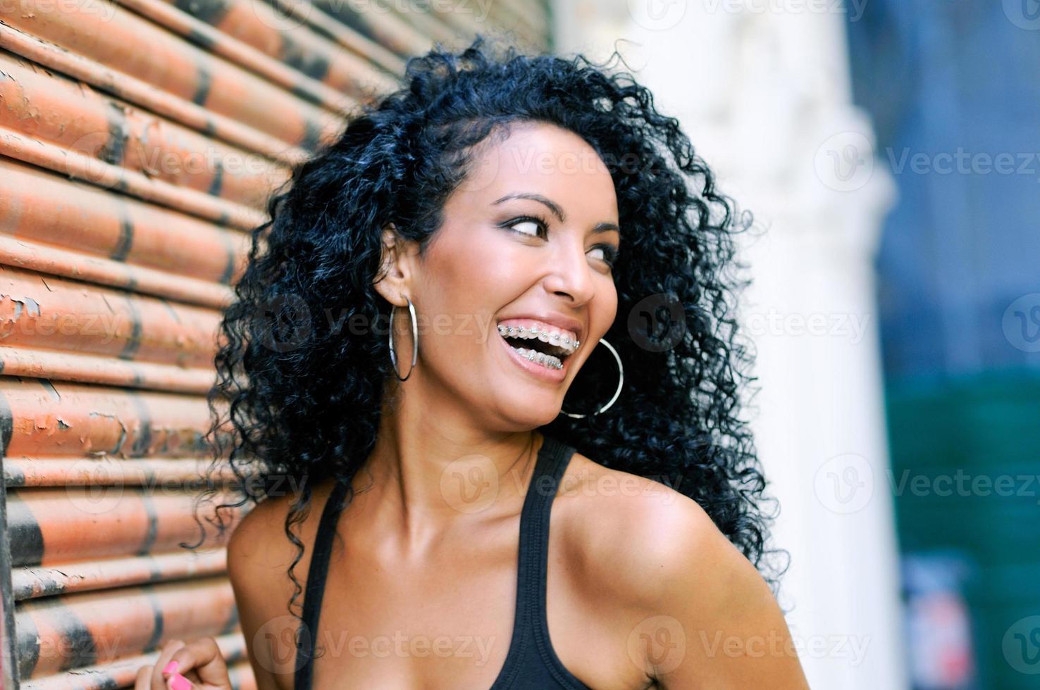Young black woman smiling with braces photo